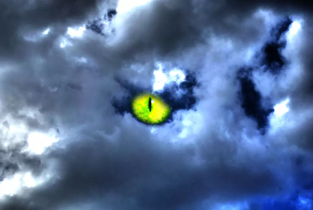 a cat's eye, seen through a break in the clouds